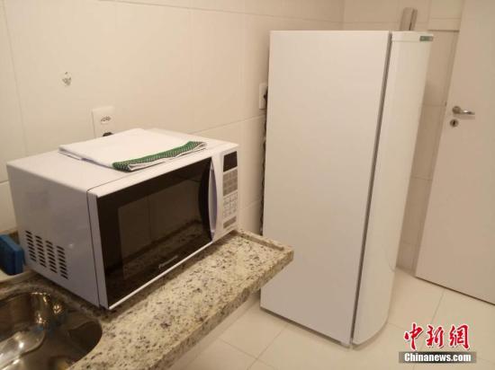 厨房里有简单的家用电器。 <a target='_blank' href='http://www.chinanews.com/'>中新社</a>记者 卢岩 摄