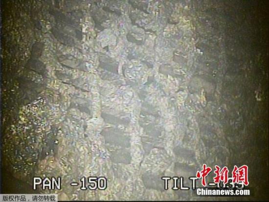 资料图：东京电力公司公布对福岛第一核电站2号机组反应堆安全壳内拍摄到的图像。根据分析，结果显示内部空间辐射量推算为最大每小时530希沃特。