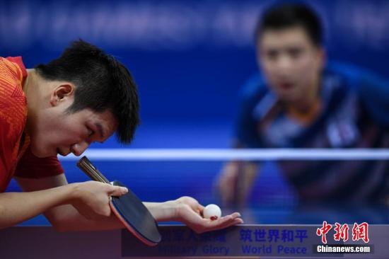 资料图：樊振东在比赛中。 /p中新社记者 何蓬磊 摄