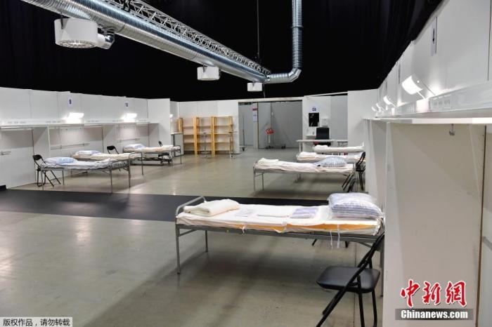 当地时间3月30日，瑞典斯德哥尔摩国际会展中心被改建成一家野战医院，为收治新冠肺炎患者准备的病床。
