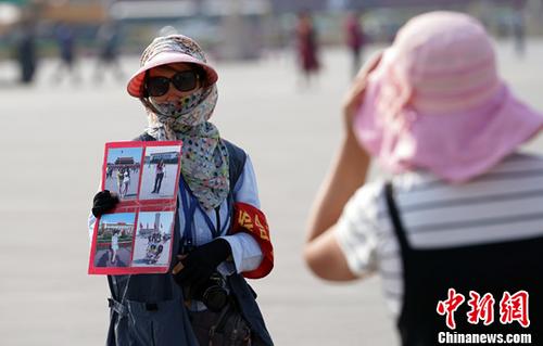 北京持续高温。中新社记者 毛建军 摄